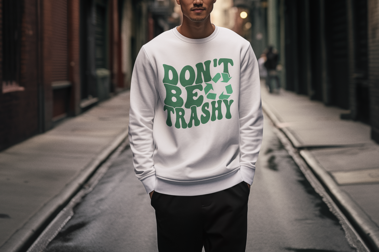 A man walking outside wearing a "Don't Be Trashy" White Sweatshirt
