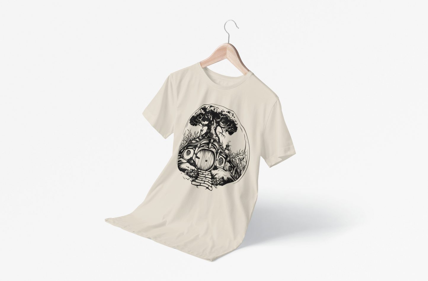 A beige T-shirt on a hanger that as a Hobbit Home on it