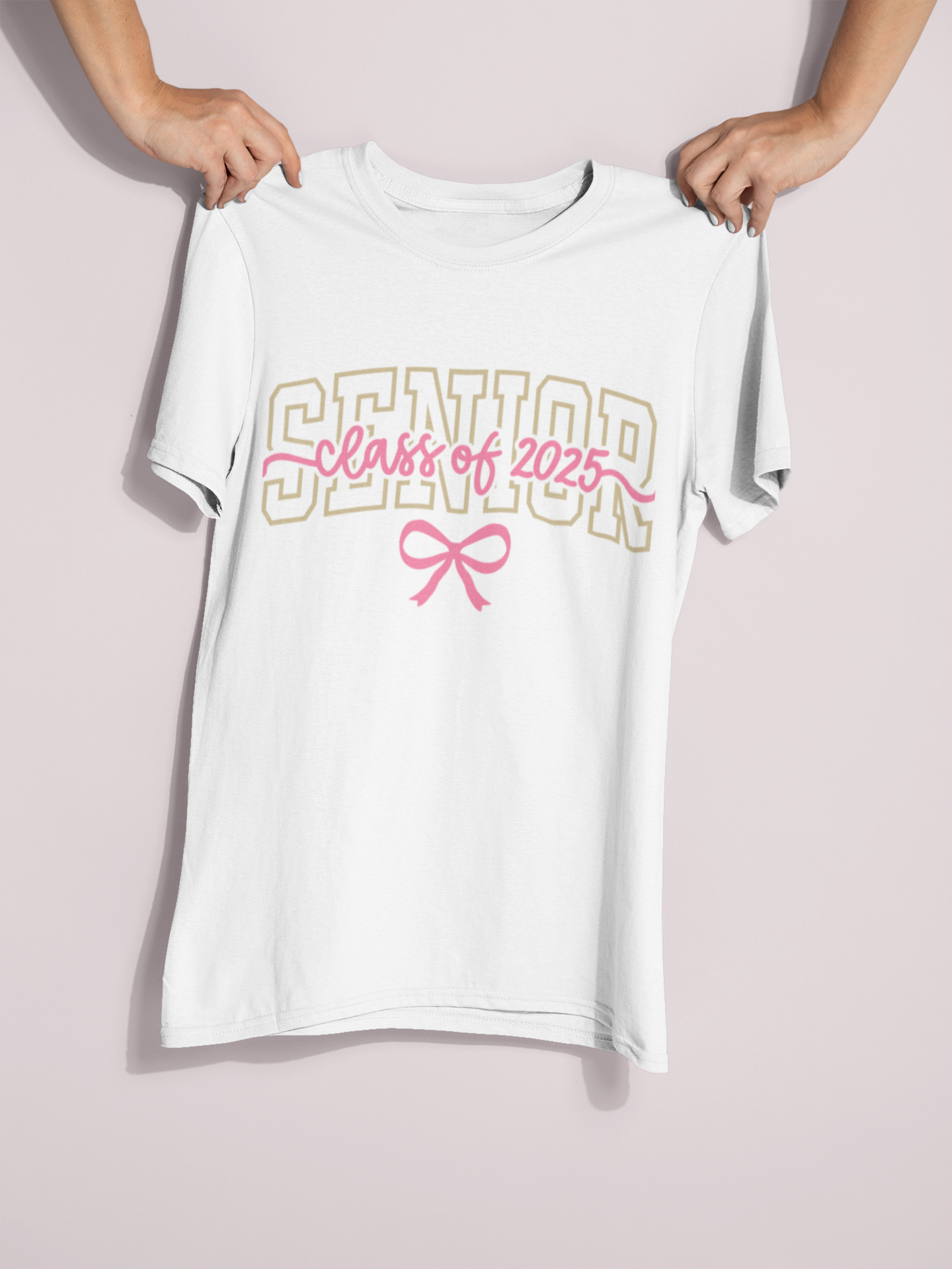 Someone holding out a "Senior, Class of 2025" T-Shirt