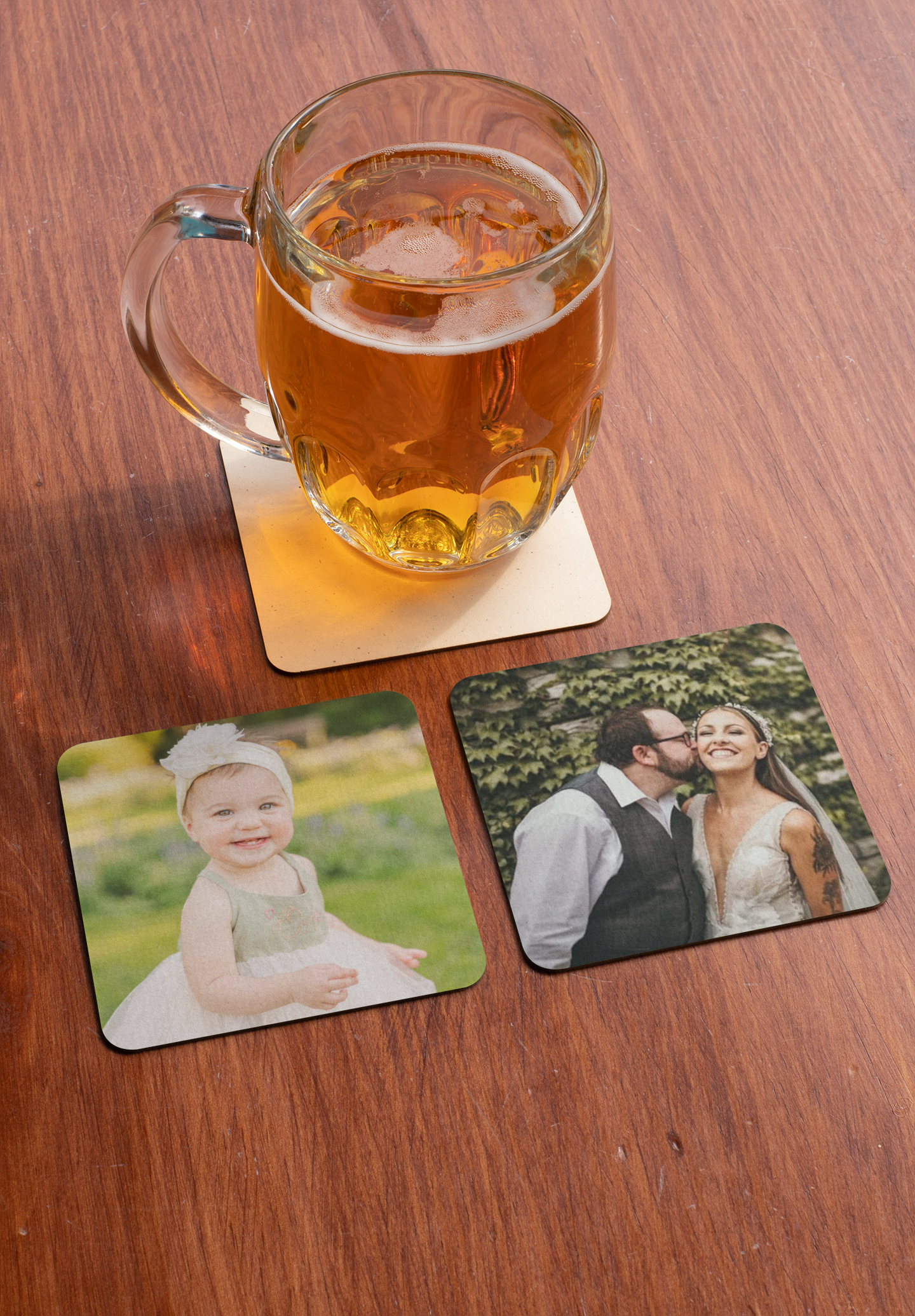Two coasters with custom photos on a coffee table