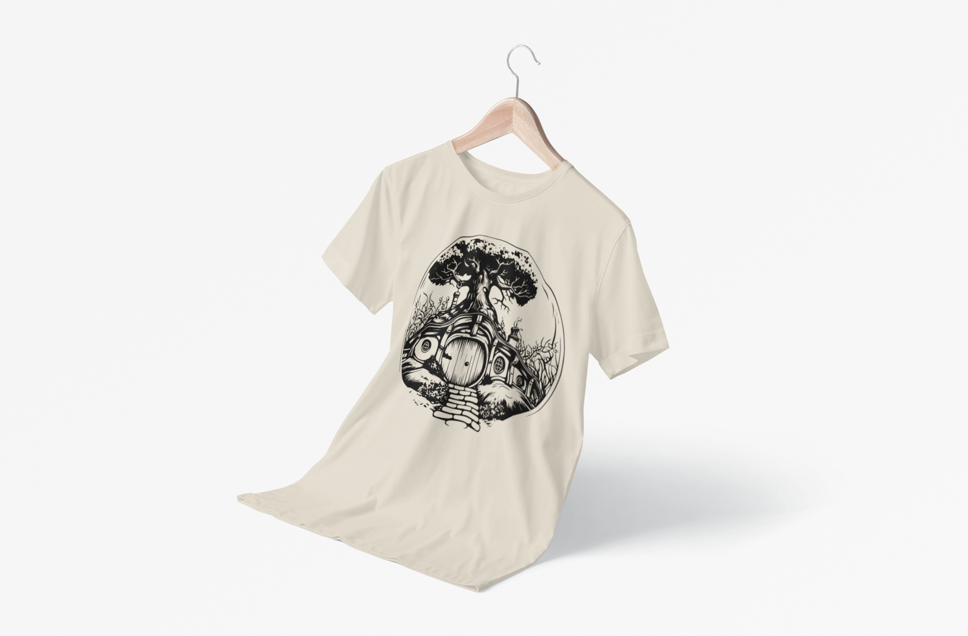 A beige T-shirt on a hanger that as a Hobbit Home on it