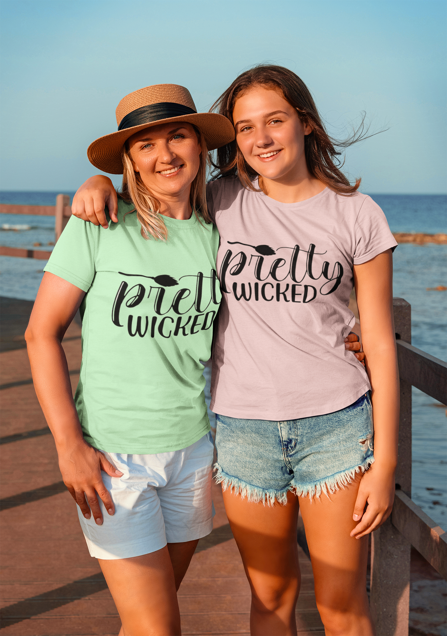 Two girls smiling wearing "Pretty Wicked" T-Shirts