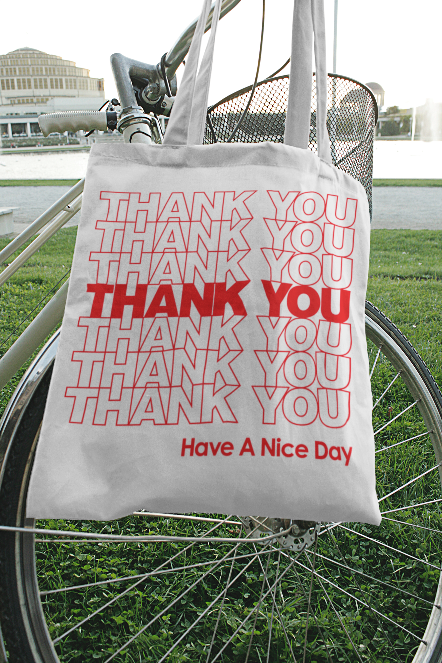 A bike with a cream totes bag that say "Thank You, Have a Nice Day" written on it